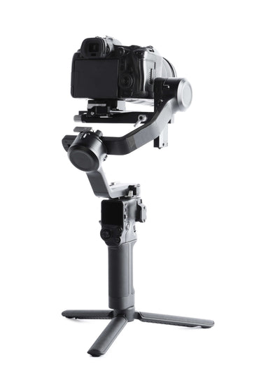 A camera on a gimbal against a white background.