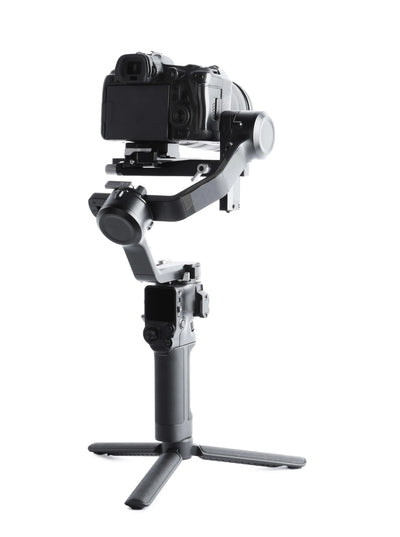 A camera on a gimbal against a white background.